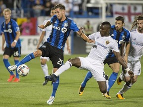 Montreal Impact's Louis Béland-Goyette challenges Real Salt Lake's Stephen Sunday during the first half of MLS soccer action in Montreal, Saturday, Aug. 19, 2017.