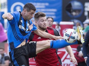 Montreal Impact's Blerim Dzemaili, left, challenges Toronto FC's Eriq Zavaleta during first half MLS soccer action in Montreal, Sunday, August 27, 2017.