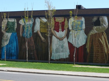 Street art called Les Filles du Roy by the artist Annie Hamel at Wellington St., corner Filles du Roi S. in the Sud-Ouest borough. Archie Fineberg says this complex piece, which recalls an important part of our history, also demonstrates the artist’s technical skill at painting drapery and fabric, a talent for which she’s well known.