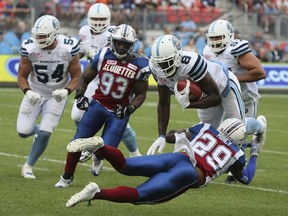 Alouettes defensive back Jonathon Mincy tries to tackle Toronto Argonauts wide receiver Jeff Fuller during CFL action in Toronto, Ont., on Saturday Aug. 19, 2017.