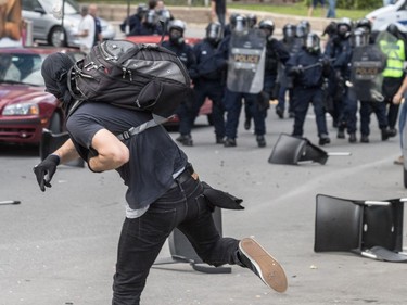 The far-right group La Meute and counter-protesters, organized by a group called Citizen Action Against Discrimination as well as the Ligue anti-fasciste Québec clashed in Quebec City, on Sunday, August 20, 2017. A group of masked demonstrators threw bottles and chairs at the police.