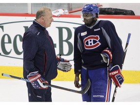 Montreal Canadiens head coach Michel Therrien talks with defenceman P.K. Subban at the Bell Sports Complex in Brossard near Montreal, on Friday, March 13, 2015.