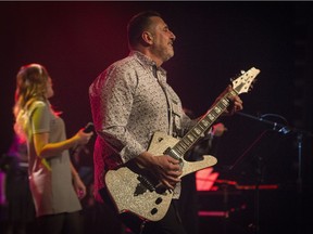 Pierrefonds-Roxboro borough mayor Jim Beis plays guitar during the fifth annual fundraising music show for Action Jeunesse de l'Ouest-de-l'îIe (AJOI) on April 8. AJOI will celebrate its 10th anniversary at a reception in Dorval on Thursday.