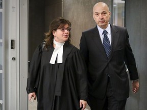 Former Montreal executive committee chairman Frank Zampino leaves the courtroom with lawyer Isabel Schurman for the lunch break in the Contrecoeur corruption trial at the Palais de Justice in Montreal Monday May 1, 2017.