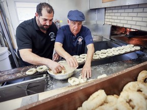 Owner Joe Morena and his son Robert prepare bagels at their St. Viateur Bagels shop in Montreal Monday May 15, 2017.