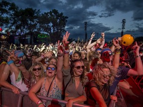 Fans dance along to Major Lazer during the Osheaga Music and Arts Festival at Parc Jean Drapeau in Montreal on Saturday, August 5, 2017. (Peter McCabe / MONTREAL GAZETTE)