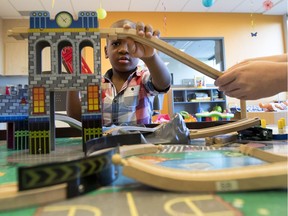 Raphael Personna, 5, builds a racetrack in the daycare for siblings of sick kids at the Montreal Children's Hospital Aug. 28, 2017.