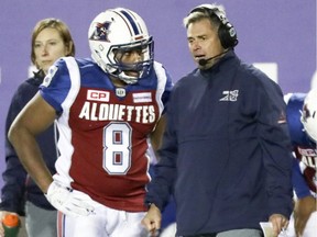 Montreal Alouettes head coach Jacques Chapdelaine confers with reciever Nik Lewis during second half of Canadian Football League game against the Ottawa Redblacks in Montreal Thursday August 31, 2017.