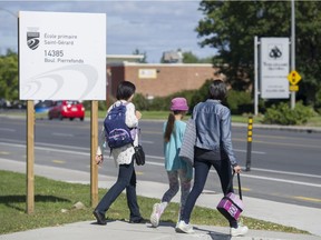Students leave École St-Gérard in Pierrefonds last Friday afternoon.