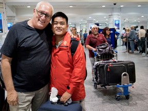 Bernard Voyer greets Nima Nuru Sherpa at Trudeau airport on Sept. 6. The Montreal explorer and motivational speaker arranged to pay for the boy's education in Kathmandu, and later paved the path for his move to Montreal.