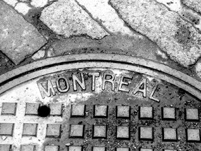 A manhole cover in Old Montreal, 1997.