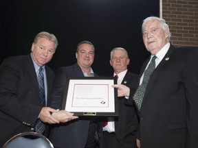 Joe Mell (right) of Leo's Boys Sports Association was honoured at the annual Point St. Charles Hall of Recognition breakfast and received an award from Hockey Canada, on Sept. 9, 2017. (From left-to-right: Kevin Figsby, Greg Choules, Howie Myers and Joe Mell).