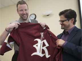 St-Lazare Revolution head coach Eric Labrosse (right) and general manager Dustin Traylen display the hockey jersey of the new team last Thursday.