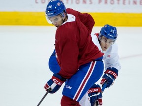 Maxime Fortier, right, tries to get around Jordan Boucher during the Canadiens rookie camp on Wednesday. Both players have been invited to participate in the main camp.