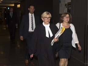 Crown prosecutor Lyne Décarie walks back to the courtroom following a break in the trial of Sabrine Djermane and El Mahdi Jamali on Thursday in Montreal.