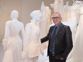 Designer Jean Paul Gaultier poses in front of his wedding-themed exhibition Love is Love at the Montreal Museum of Fine Arts.