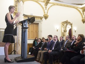 Joelle Pineau (L), director, FAIR Montreal speaks during a press conference as Canada's Prime Minister Justin Trudeau and Mike Schroepfer, chief technology officer, Facebook look on at a press conference announcing Facebook was opening a new artificial intelligence lab in conjunction with McGill in Montreal Montreal, September 15, 2017.