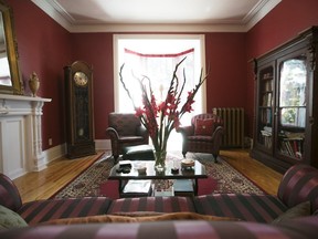 The living room in the Westmount apartment of Anne Renaud features a grandfather clock that belongs to her landlady.