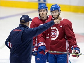 Canadiens head coach Claude Julien speaks with Montreal Canadiens right wing Brendan Gallagher, left, and Montreal Canadiens left wing Phillip Danault during a training camp session at the Bell Sports Complex in Montreal on Friday September 15, 2017.