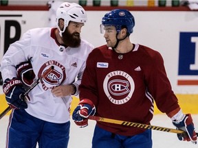 Montreal Canadiens' Jordie Benn and Jonathan Drouin, right, chat during practice at the Bell Sports Complex in Brossard, on Tuesday, September 19, 2017.