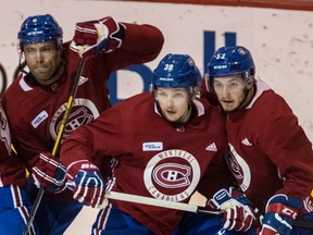 Canadiens, from left, Shea Weber, Nikita Scherback and Victor Mete jostle in front of the net during practice at the Bell Sports Complex in Brossard, on Tuesday, September 19, 2017.