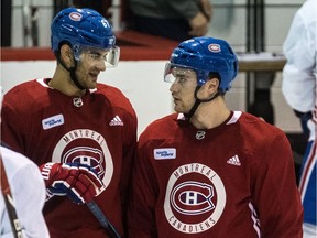 The Montreal Canadiens captain Max Pacioretty and Jonathan Drouin, right, chat during practice at the Bell Sports Complex in Brossard, on Tuesday, September 19, 2017. (Dave Sidaway / MONTREAL GAZETTE)