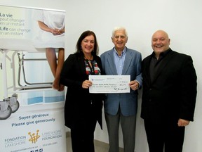 Dollard-des-Ormeaux Mayor Ed Janiszewski, centre, presents $200,000 cheque to Lakeshore General Hospital Foundation executive director Heather Holmes and board of directors co-chair Dr. Fiore Lalla.