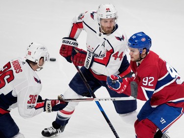 Montreal Canadiens left wing Jonathan Drouin gets held back by Washington Capitals Connor Hobbs, left, and Washington Capitals defenceman Brooks Orpik during pre-season NHL play at the Bell Centre in Montreal on Wednesday September 20, 2017.