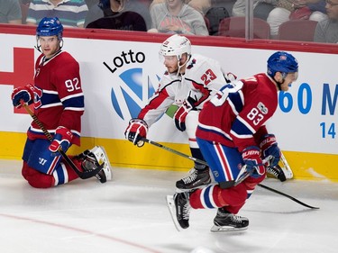Montreal Canadiens left wing Jonathan Drouin looks back at the play after being knock to the ice during pre-season NHL play at the Bell Centre in Montreal on Wednesday September 20, 2017. Washington Capitals left wing Zach Sill and Montreal Canadiens right wing Ales Hemsky scramble for the puck
