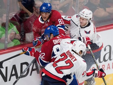 Montreal Canadiens right wing Ales Hemsky grimaces as he is driven in to the boards by Washington Capitals Jyrki Jokipakka, as Capitals Madison Bowey hits Montreal Canadiens left wing Jonathan Drouin during pre-season NHL play at the Bell Centre in Montreal on Wednesday September 20, 2017.