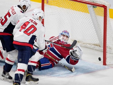 Montreal Canadiens goalie Charlie Lindgren falls back in to his crease as Washington Capitals right wing Devante Smith-Pelly scores during pre-season NHL play at the Bell Centre in Montreal on Wednesday September 20, 2017. Washington Capitals Garrett Pilon looks on.