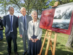 Moray Clouston, centre, with wife, Maggie, and nephew Milo attended a Parks Canada ceremony Thursday to honour war hero J. Campbell Clouston.