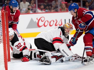 Montreal Canadiens right wing Brendan Gallagher gets caught in New Jersey Devils goalie Keith Kinkaid's blocker as New Jersey Devils defenceman Michael Kapla and Montreal Canadiens centre Alex Galchenyuk look on during pre-season NHL action at the Bell Centre in Montreal on Thursday September 21, 2017.