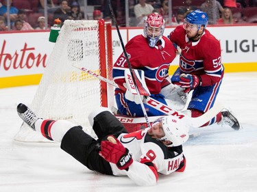 Montreal Canadiens goalie Carey Price braces to be hit by Montreal Canadiens defenceman Éric Gélinas after he tripped New Jersey Devils left wing Taylor Hall during pre-season NHL action at the Bell Centre in Montreal on Thursday September 21, 2017. A penalty against Gélinas was called on the play.