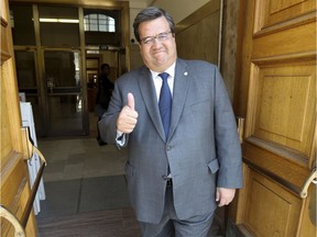 Montreal Mayor Denis Coderre gives the thumbs up outside City Hall after officially registering his candidacy in the upcoming municipal elections in Montreal Friday Sept. 22, 2017.