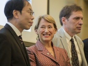 McGill Principal Suzanne Fortier, centre, with architect and McGill alumnus Peter Guo-hua Fu, left, as he announced Tuesday, Sept. 26, 2017, his pledge to donate $12 million to the School of Architecture.