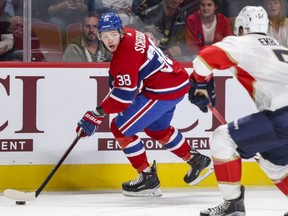 Canadiens' Nikita Scherbak looks to make a pass while being watched by Florida Panthers Aaron Ekblad in Montreal on Friday Sept. 29, 2017. Scherbak was cut by the team Saturday, Sept. 30, 2017.