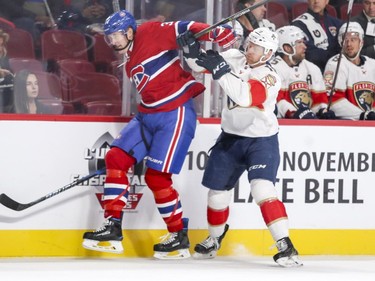 Canadiens' Michael McCarron, left, skates through a check by Florida Panthers' Michael Matheson in Montreal on Friday, Sept. 29, 2017.