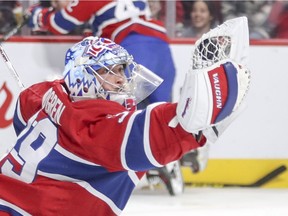 Canadiens goalie Charlie Lindgren makes a glove save against the Florida Panthers in Montreal on Friday, Sept. 29, 2017.