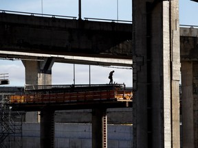 A worker secures rebar for a new pillar being built as part of the Turcot Exchange project in Montreal on Nov. 9, 2016.