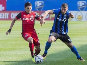Montreal Impact&#039;s Blerim Dzemaili, right, challenges Toronto FC&#039;s Marky Delgado during first half MLS soccer action in Montreal, Sunday, August 27, 2017. As league-leading Toronto FC continues its march towards the Supporters Shield, it looks to pause Wednesday and kick rival Montreal when it&#039;s down. THE CANADIAN PRESS/Graham Hughes
