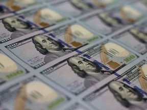 The $100 U.S. bill has security features like a duplicating portrait of Benjamin Franklin and microprinting added to make the bill more difficult to counterfeit.