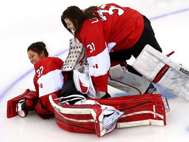 Charline Labonté #32 and Genevieve Lacasse #31 of Canada pose for photo on the ice prior to their Women's Ice Hockey practice session ahead of the Sochi 2014 Winter Olympics at the Shayba Arena on February 6, 2014 in Sochi, Russia.