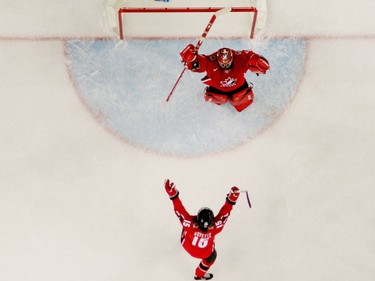 Goalie Charline Labonté #30 and Danielle Goyette #15 both of Canada celebrate their 4-1 victory over Sweden to win the gold medal in women's ice hockey during Day 10 of the Turin 2006 Winter Olympic Games on February 20, 2006 at the Palasport Olimpico in Turin, Italy.