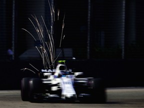 F1 Grand Prix of Singapore - Qualifying

SINGAPORE - SEPTEMBER 16: Lance Stroll of Canada driving the (18) Williams Martini Racing Williams FW40 Mercedes on track during final practice for the Formula One Grand Prix of Singapore at Marina Bay Street Circuit on September 16, 2017 in Singapore.  (Photo by Clive Mason/Getty Images) ORG XMIT: 687703027

Images may only be used in print media or on the internet.
Clive Mason, Getty Images