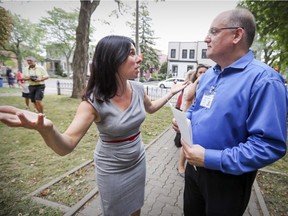 Projet Montreal leader Valerie Plante talks with Patrick Letourneau, director general of La Maison du Pharillon drug- treatment centre during a campaign visit in Montreal on Wednesday, Sept. 27, 2017.