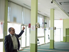 Mohamed Labidi, the president of the Centre Culturel Islamique de Québec, points at the surveillance camera inside the prayer room in Quebec City on May 25, 2017 where the Quebec City mosque attack took place.