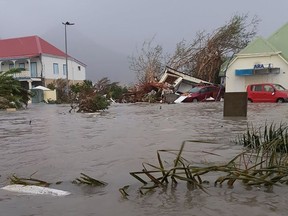 This handout picture released on September 6, 2017, on the twitter account of RCI.fm shows a flooded street on the French overseas island of Saint-Martin.