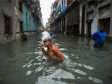 A Cuban wades through a flooded street in Havana, Sept. 10, 2017. Deadly Hurricane Irma battered central Cuba on Saturday. (Yamil Lage, AFP/Getty Images)