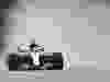 Lewis Hamilton’s Mercedes kicks up spray during Friday’s rain-hit morning practice session at Sepang International Circuit.